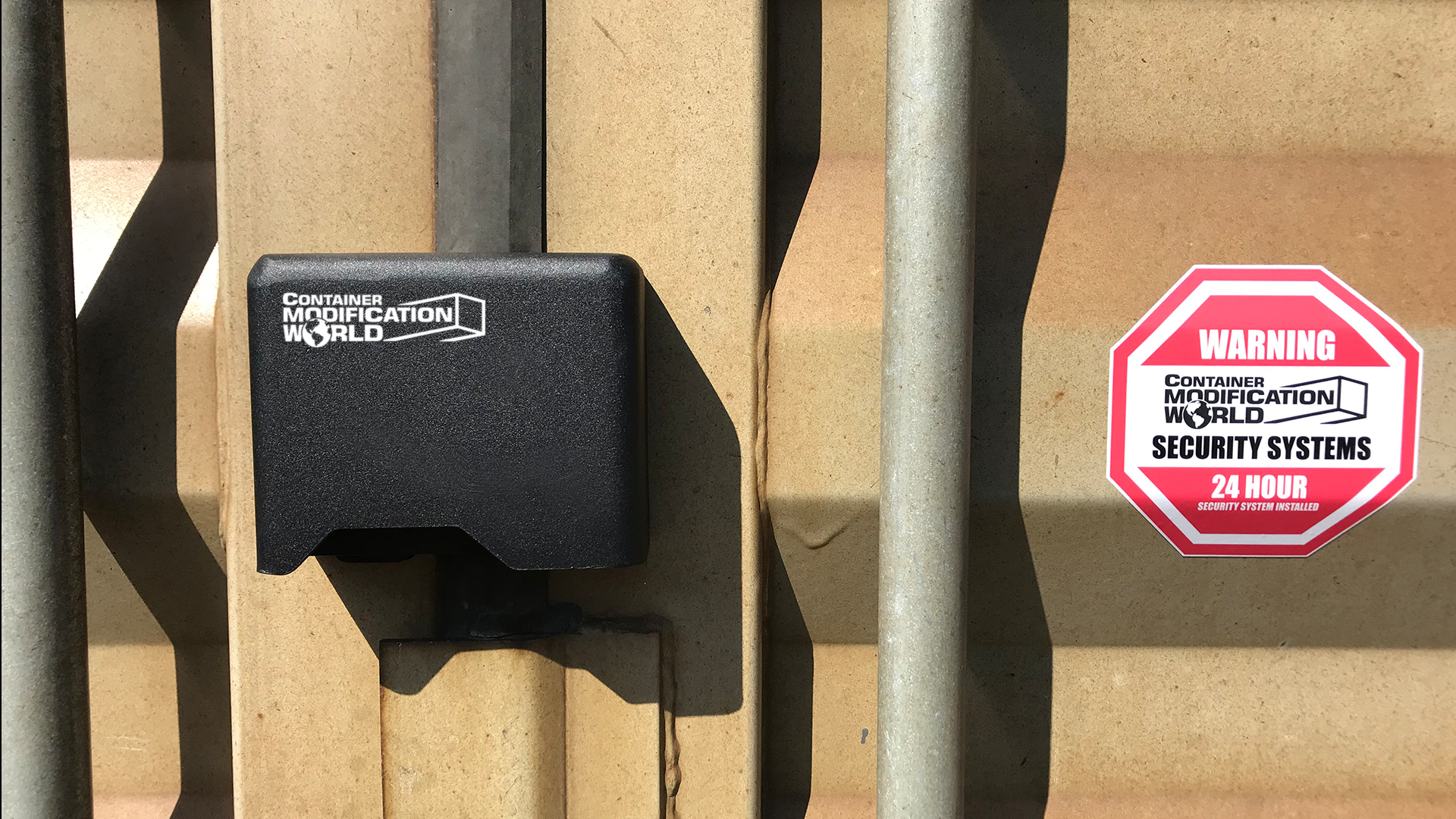 Right-hand container lock box securely mounted on shipping container door, shown alongside a red warning security decal from Container Modification World.